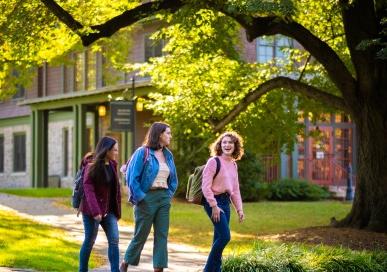 Three students walking in front of Benham Gateway Admissions